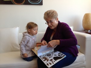 Checking out a sticker book at Titi and Nini's rented apartment in Jersey City. Nice digs, grand'rents!